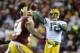 Jan 10, 2016; Landover, MD, USA; Green Bay Packers quarterback Aaron Rodgers (12) throws the ball over Washington Redskins inside linebacker Mason Foster (54) during the first half in a NFC Wild Card playoff football game at FedEx Field. Mandatory Credit: