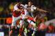 LONDON, ENGLAND - SEPTEMBER 23: Mikel Arteta of Arsenal and Son Heung-Min of Tottenham Hotspur battle for the ball during the Capital One Cup third round match between Tottenham Hotspur and Arsenal at White Hart Lane on September 23, 2015 in London, Engl