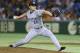 This picture taken on April 3, 2015 shows South Korean pitcher Oh Seung-Hwan of the Hanshin Tigers in the Nippon Professional Baseball league throwing against the Yomiuri Giants at the Tokyo Dome. The star South Korean pitcher pursuing a US major league b