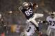 19 Jan 2002: Jermaine Wiggins #85 of the New England Patriots flies through the air when trying to jump over Anthony Dorsett #33 of the Oakland Raiders during the AFC playoff game at Foxboro Stadium in Foxboro, Massachuesetts. The Patriots came from behi