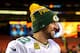 LANDOVER, MD - JANUARY 10: Quarterback Aaron Rodgers #12 of the Green Bay Packers smiles during a post game interview after the Green Bay Packers defeated the Washington Redskins 35-18 during the NFC Wild Card Playoff game at FedExField on January 10, 201