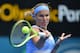 Svetlana Kuznetsova of Russia hits a return to Simona Halep of Romania during their women's singles semi-final match at the Sydney International tennis tournament in Sydney on January 15, 2016. AFP PHOTO / Peter PARKS -- IMAGE RESTRICTED TO EDITORIAL USE