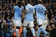 Manchester City's Ivorian striker Wilfried Bony (L) celebrates with teammates after scoring the opening goal during the English League Cup fourth round football match between Manchester City and Crystal Palace at The Etihad Stadium in Manchester, north we