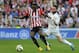 Athletic Bilbao's forward Inaki Williams (L) vies with Real Madrid's defender Daniel Carvajal during the Spanish league football match Athletic Club Bilbao vs Real Madrid CF at the San Mames stadium in Bilbao on March 7, 2015. AFP PHOTO/ ANDER GILLENEA