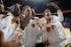 OAKLAND, CA - OCTOBER 27: Draymond Green #23 of the Golden State Warriors, Klay Thompson #11 of the Golden State Warriors and Stephen Curry #30 of the Golden State Warriors show off their championship rings with their teammates before the game against th