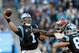 CHARLOTTE, NC - JANUARY 03: Greg Olsen #88 tries to protect teammate Cam Newton #1 of the Carolina Panthers from the Tampa Bay Buccaneers pass rush in the 1st quarter during their game at Bank of America Stadium on January 3, 2016 in Charlotte, North C
