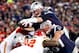 Jan 16, 2016; Foxborough, MA, USA; New England Patriots quarterback Tom Brady (12) dives for a touchdown during the second quarter against the Kansas City Chiefs in the AFC Divisional round playoff game at Gillette Stadium. Mandatory Credit: Greg M. Coope