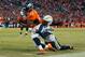 DENVER, CO - JANUARY 3: Running back C.J. Anderson #22 of the Denver Broncos is tackled by strong safety Jahleel Addae #37 of the San Diego Chargers as he rushes for a first down in the third quarter of a game at Sports Authority Field at Mile High on Ja