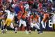 Jan 17, 2016; Denver, CO, USA; Denver Broncos quarterback Peyton Manning (18) throws during the third quarter in a AFC Divisional round playoff game at Sports Authority Field at Mile High. Mandatory Credit: Isaiah J. Downing-USA TODAY Sports
