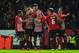 EXETER, ENGLAND - JANUARY 08: Lee Holmes of Exeter City (C) celebrates with team mates as he scores their second goal during the Emirates FA Cup third round match between Exeter City and Liverpool at St James Park on January 8, 2016 in Exeter, England.