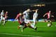 EXETER, ENGLAND - JANUARY 08: Jose Enrique of Liverpool challenges Tom Nichols of Exeter City as he shoots during the Emirates FA Cup third round match between Exeter City and Liverpool at St James Park on January 8, 2016 in Exeter, England. (Photo by D