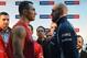Ukrainian Heavyweight World Champion Wladimir Klitschko (2nd L) and his challenger Britain's Tyson Fury (R) pose for a face-off during an official weigh-in in Essen, western Germany on November 27, 2015. World heavyweight champion Klitschko will defend hi