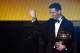 FC Barcelona and Argentina's forward Lionel Messi waves holding his trophy after receiving the 2015 FIFA Ballon dOr award for player of the year during the 2015 FIFA Ballon d'Or award ceremony at the Kongresshaus in Zurich on January 11, 2016. AFP PHOTO