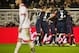 Atletico Madrid players celebrate after scoring their second goal during the Spanish league football match Rayo Vallecano de Madrid vs Club Atletico de Madrid at Vallecas stadium in Madrid on December 30, 2015. AFP PHOTO/ CURTO DE LA TORRE / AFP / CURTO