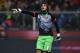 GENOA, ITALY - JANUARY 05: Mattia Perin of Genoa CFC reacts during the Serie A match between Genoa CFC and UC Sampdoria at Stadio Luigi Ferraris on January 5, 2016 in Genoa, Italy. (Photo by Valerio Pennicino/Getty Images)
