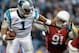 CHARLOTTE, NC - JANUARY 24: Cam Newton #1 of the Carolina Panthers stiff arms Ed Stinson #91 of the Arizona Cardinals in the second half during the NFC Championship Game at Bank of America Stadium on January 24, 2016 in Charlotte, North Carolina. (Photo