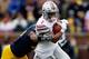 ANN ARBOR, MI - NOVEMBER 28: Terry Richardson #13 of the Michigan Wolverines tackles Braxton Miller #1 of the Ohio State Buckeyes during the second quarter at Michigan Stadium on November 28, 2015 in Ann Arbor, Michigan. (Photo by Gregory Shamus/Getty Im