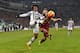 TURIN, ITALY - JANUARY 24: Juan Cuadrado (L) of Juventus FC competes with Lucas Digne of AS Roma during the Serie A match between Juventus FC and AS Roma at Juventus Arena on January 24, 2016 in Turin, Italy. (Photo by Valerio Pennicino/Getty Images)