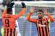 Shakhtar Donetsk's Brazilian midfielder Alex Teixeira (R) celebrates with Shakhtar Donetsk's Brazilian midfielder Dentinho after scoring during the UEFA Champions League group A football match between Shakhtar Donetsk and Real Madrid in Lviv on November 2
