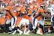DENVER, CO - JANUARY 24: Peyton Manning #18 of the Denver Broncos drops back to pass against the New England Patriots in the AFC Championship game at Sports Authority Field at Mile High on January 24, 2016 in Denver, Colorado. (Photo by Dustin Bradford