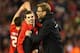 LIVERPOOL, ENGLAND - JANUARY 26: Jurgen Klopp manager of Liverpool and Jon Flanagan of Liverpool celebrate victory in the penalty shoot out after the Capital One Cup semi final second leg match between Liverpool and Stoke City at Anfield on January 26, 2
