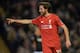 Liverpool's Welsh midfielder Joe Allen celebrates after scoring the opening goal of the English FA Cup third round replay football match between Liverpool and Exeter City at Anfield in Liverpool, north west England on January 20, 2016. AFP PHOTO / PAUL EL