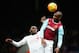 LONDON, ENGLAND - JANUARY 02: Angelo Ogbonna Obinza of West Ham United and Christian Benteke of Liverpool compete for the ball during the Barclays Premier League match between West Ham United and Liverpool at Boleyn Ground on January 2, 2016 in London, En