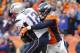 Jan 24, 2016; Denver, CO, USA; New England Patriots quarterback Tom Brady (12) is tackled by Denver Broncos outside linebacker Von Miller (58) in the third quarter in the AFC Championship football game at Sports Authority Field at Mile High. Mandatory Cre