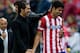 MADRID, SPAIN - OCTOBER 27: Head coach Diego Simeone of Atletico de Madrid congratulates goal-scorer Diego Costa during the La Liga match between Club Atletico de Madrid and Real Betis Balompieat at Vicente Calderon Stadium on October 27, 2013 in Madrid,