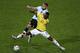 Colombia's forward Jackson Martinez (front) vies for the ball with Argentina's defender Nicolas Otamendi during the 2015 Copa America football championship quarterfinal match, in Vina del Mar, Chile on June 26, 2015. AFP PHOTO / CLAUDIO REYES (P