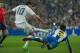 Real Madrid's Colombian midfielder James Rodriguez (L) shoots to score as Espanyol's defender Ruben Duarte falls on the ground during the Spanish league football match Real Madrid CF vs RCD Espanyol at the Santiago Bernabeu stadium in Madrid on January 31