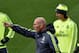 Real Madrid's new French coach Zinedine Zidane (C) points his finger next to Real Madrid's Welsh forward Gareth Bale (L) and Real Madrid's Croatian midfielder Luka Modric (R) during a training session at the Valdebebas training ground in Madrid on January