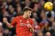 Liverpool's English midfielder Adam Lallana wins a header during the English League Cup semi-final second leg football match between Liverpool and Stoke City at Anfield in Liverpool, north west England, on January 26, 2016. / AFP / Paul ELLIS / RESTRICTED
