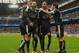 MANCHESTER, ENGLAND - FEBRUARY 06: Riyad Mahrez (2nd R) of Leicester City celebrates scoring his team's second goal with his team mates Shinji Okazaki (1st R), Danny Simpson (2nd L) and Jamie Vardy (1st L) during the Barclays Premier League match between