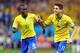 SAO PAULO, BRAZIL - JUNE 12: Oscar and Ramires of Brazil in celebrat during the 2014 FIFA World Cup Brazil Group A match between Brazil and Croatia at Arena de Sao Paulo on June 12, 2014 in Sao Paulo, Brazil. (Photo by Amin Mohammad Jamali/Getty Images)