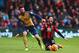 BOURNEMOUTH, ENGLAND - FEBRUARY 07: Adam Smith of Bournemouth is challenged by Olivier Giroud of Arsenal during the Barclays Premier League match between A.F.C. Bournemouth and Arsenal at the Vitality Stadium on February 7, 2016 in Bournemouth, England.