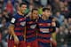 Barcelona's Brazilian forward Neymar (C) celebrates with Barcelona's Uruguayan forward Luis Suarez (L) and Barcelona's Argentinian forward Lionel Messi after scoring their third goal during the Spanish league football match FC Barcelona vs Real Sociedad d