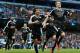 Leicester City's German defender Robert Huth (R) celebrates scoring his team's third goal with Leicester City's Japanese striker Shinji Okazaki (C) and Leicester City's Algerian midfielder Riyad Mahrez during the English Premier League football match betw