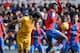 Barcelona's Uruguayan forward Luis Suarez (L) heads the ball next to Levante's Colombian midfielder Jefferson Lerma (2nd R) during the Spanish league football match Levante UD vs FC Barcelona at the Ciutat de Valencia stadium in Valencia on February 7, 20