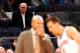 NEW YORK, NY - OCTOBER 13: (NEW YORK DAILIES OUT) New York Knicks President Phil Jackson watches his team play against the Toronto Raptors as head coach Derek Fisher talks with Pablo Prigioni #9 at Madison Square Garden on October 13, 2014 in New York