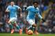 Manchester City's English midfielder Raheem Sterling (R) controls the ball during the English Premier League football match between Manchester City and Leicester City at the Etihad Stadium in Manchester, north west England, on February 6, 2016. / AFP / A