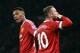 Manchester United's English striker Wayne Rooney celebrates scoring his team's second goal with Manchester United's French striker Anthony Martial during the English Premier League football match between Manchester United and Swansea City at Old Trafford