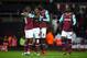 LONDON, ENGLAND - FEBRUARY 09: Michail Antonio of West Ham United (2L) celebrates with team mates as he scores their first goal during the Emirates FA Cup Fourth Round Replay match between West Ham United and Liverpool at Boleyn Ground on February 9, 201
