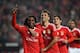Benfica's midfielder Renato Sanches (L) celebrates with teammates Brazilian forward Jonas (C) after scoring a goal during the Portuguese league football match SL Benfica vs Ass Academica de Coimbra at the Luz stadium in Lisbon on December 4, 2015. AFP P