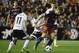 Valencia's midfielder Francisco Jose Villalba (L) vies with Barcelona's midfielder Sergi Samper during the Spanish Copa del Rey (King's Cup) semifinal second leg match Valencia CF vs FC Barcelona at the Mestalla stadium in Valencia on February 10, 2016. /