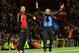 Chelsea's Portuguese manager Jose Mourinho (R) gestures as Manchester United's Welsh assistant manager Ryan Giggs looks on during the English Premier League football match between Manchester United and Chelsea at Old Trafford in Manchester, north west Eng