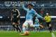 Manchester City's Spanish midfielder David Silva crosses the ball during the English Premier League football match between Manchester City and Leicester City at the Etihad Stadium in Manchester, north west England, on February 6, 2016. / AFP / ADRIAN DEN