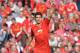 Liverpool's Uruguayan striker Luis Suarez celebrates scoring his team's second goal during the English Premier League football match between Liverpool and Tottenham Hotspur at Anfield in Liverpool, northwest England on March 30, 2014. AFP PHOTO / PAUL ELL
