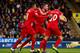 NORWICH, ENGLAND - JANUARY 23: Roberto Firmino (L) of Liverpool ceelbrates scoring his team's third goal with his team mates Jordan Henderson (C) and Adam Lallana (R) during the Barclays Premier League match between Norwich City and Liverpool at Carrow Ro