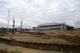 The current White Hart Lane stadium sits in the distance as building continues on its replacement.